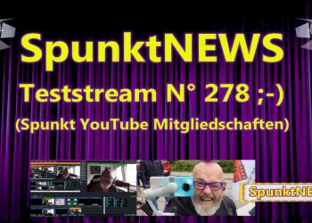 SpunktNEWS Teststream N° 278 mit lustigem Gesicht und moderner Technik hinter einer Bühnenkulisse.